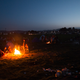 Mar. 1, 2016 – Idomeni, Greece. Refugees huddle around bonfires.
